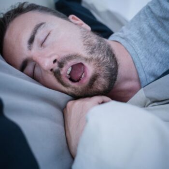 A Man Snoring from Sleep Apnea