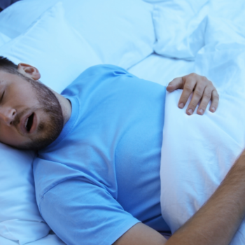 Man Sleeping with Sleep Apnea